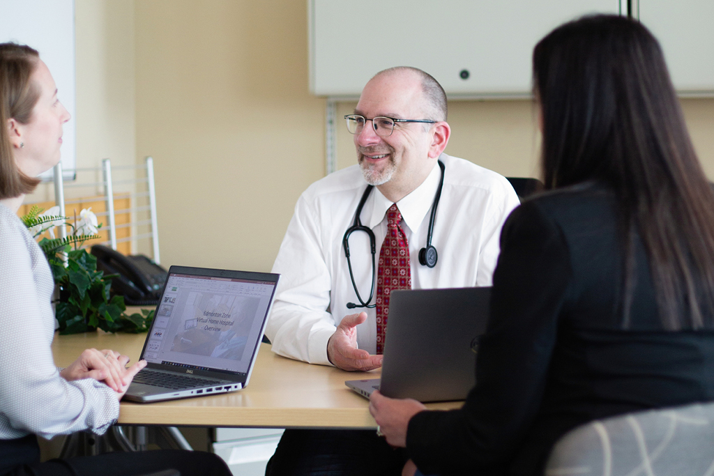 Dr. Greg Hrynchyshyn, Medical Director of the Edmonton Zone Virtual Home Hospital, with (left), Laura Mumme, Senior Project Manager, and Lisa Marco, Patient Care Manager.